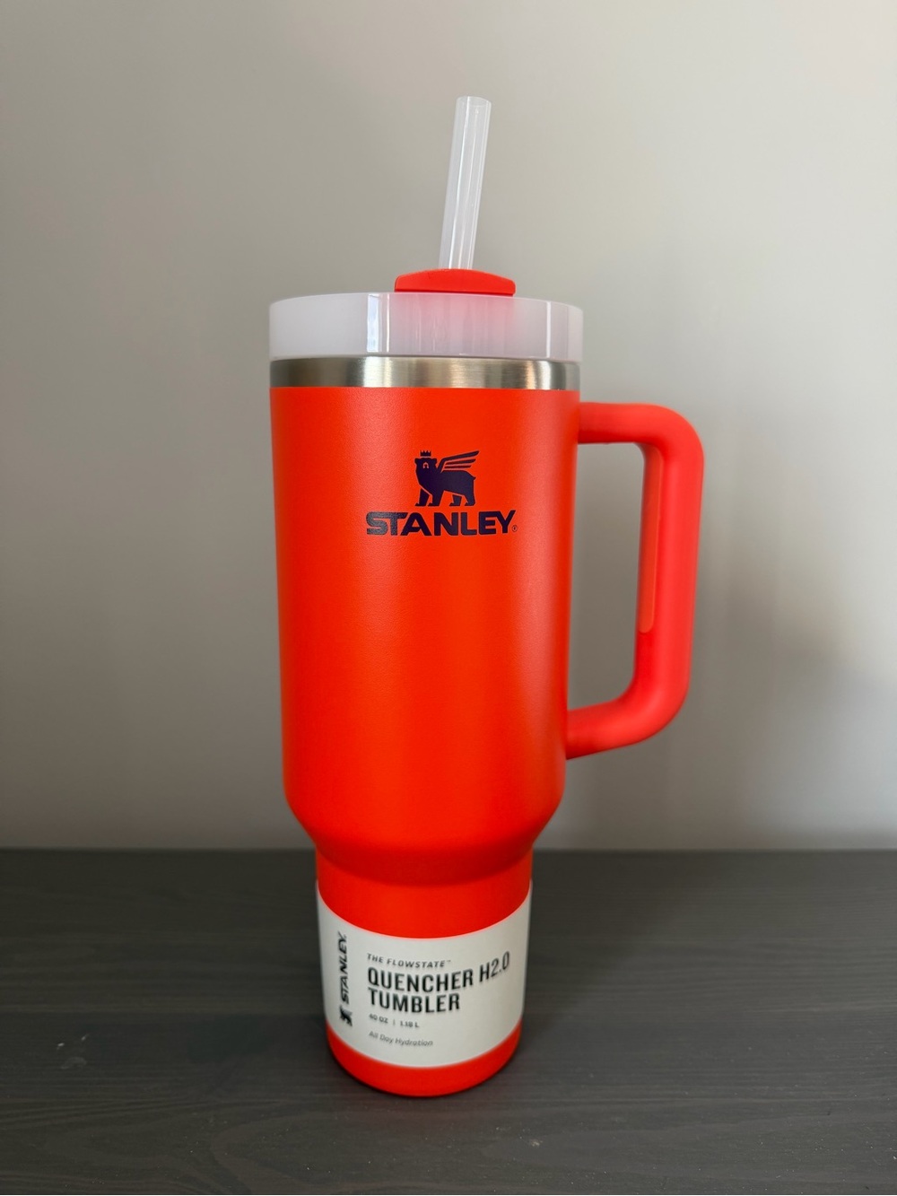 Stanley Quencher H2.0 Tumbler - Orange w/ purple accents.